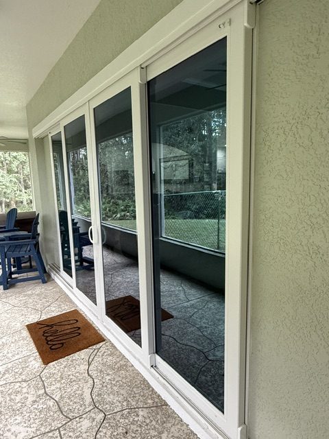 Impact windows in Clearwater: impact sliding glass doors on an enclosed porch