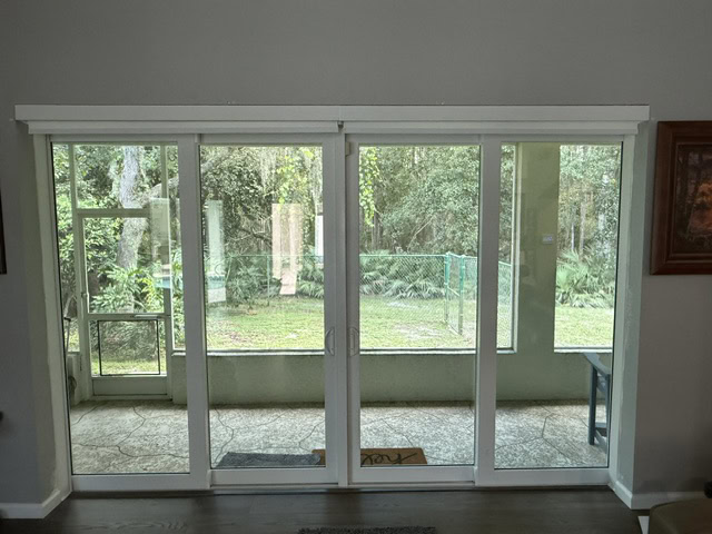 Multi-panel impact sliding glass doors from inside the home, Storm Pro door replacement in Hillsborough County