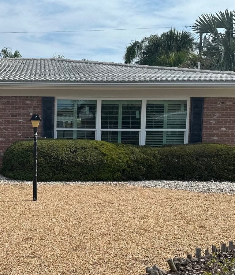 Front impact windows on a brick ranch home