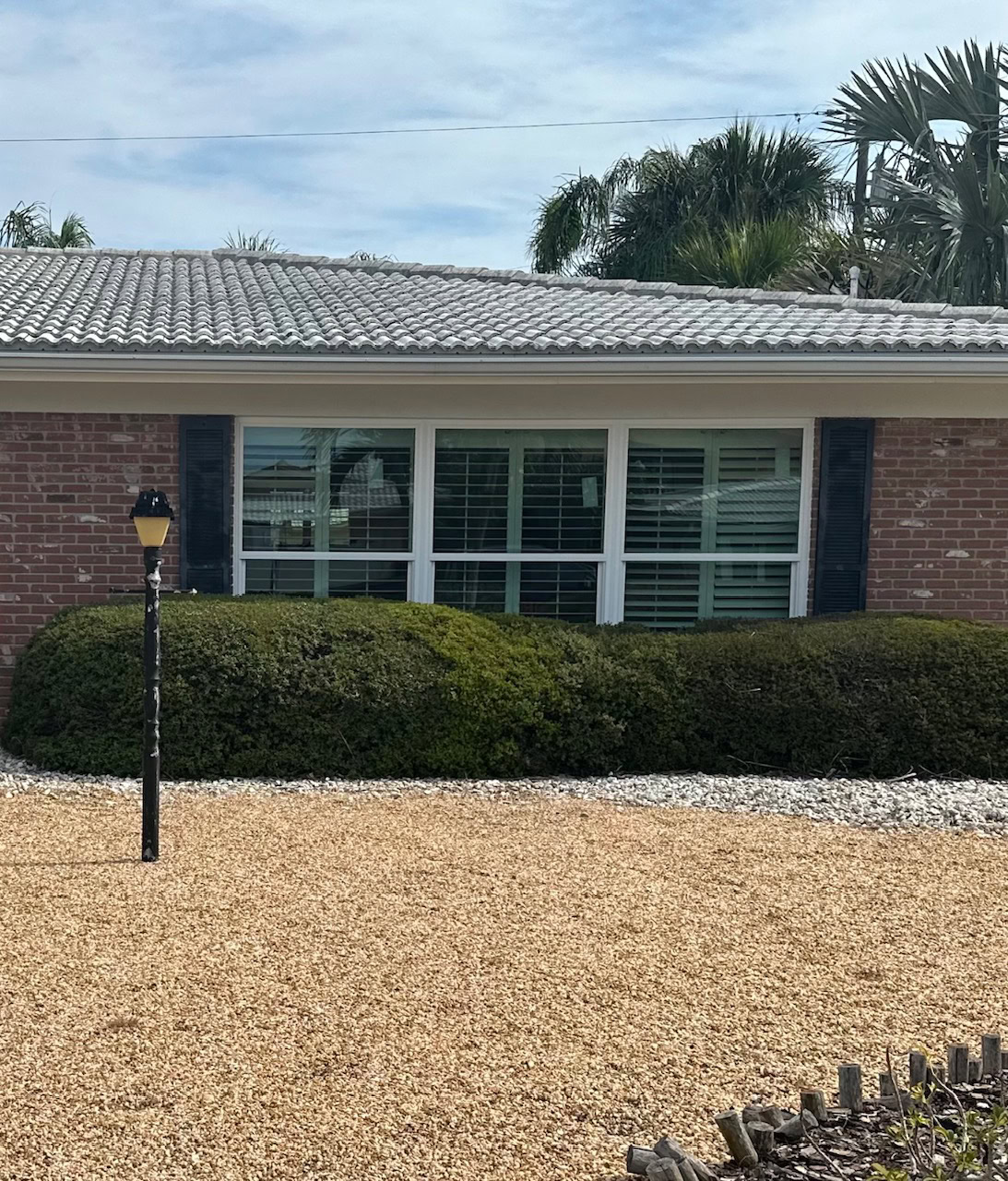 Front impact windows on a brick ranch home