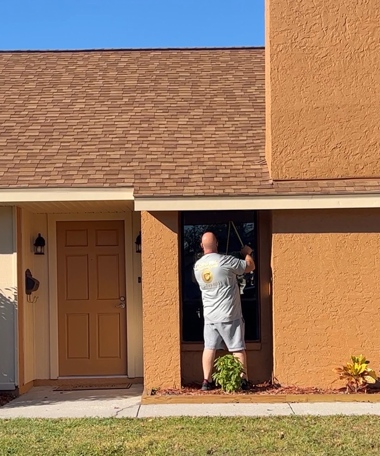 Storm Pro installer preparing an opening for impact window installation