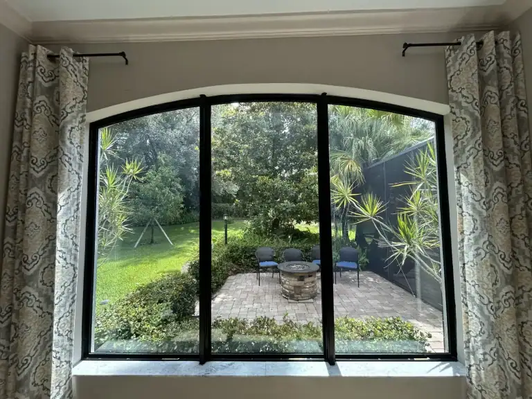 Arched impact window installed by Storm Pro