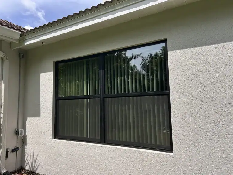 Black-frame impact windows installed by Storm Pro on a Florida home