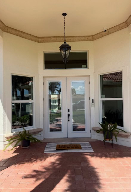 Front entry with impact French doors and sidelites after Storm Pro squared off the opening