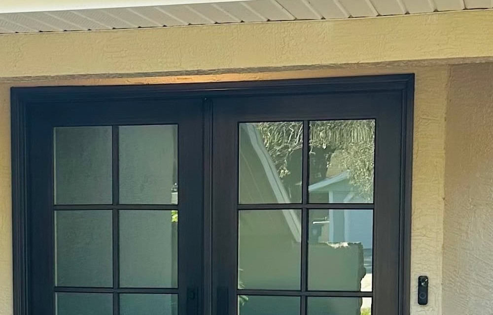 Black hurricane-rated double entry doors installed by Storm Pro for door replacement in Largo