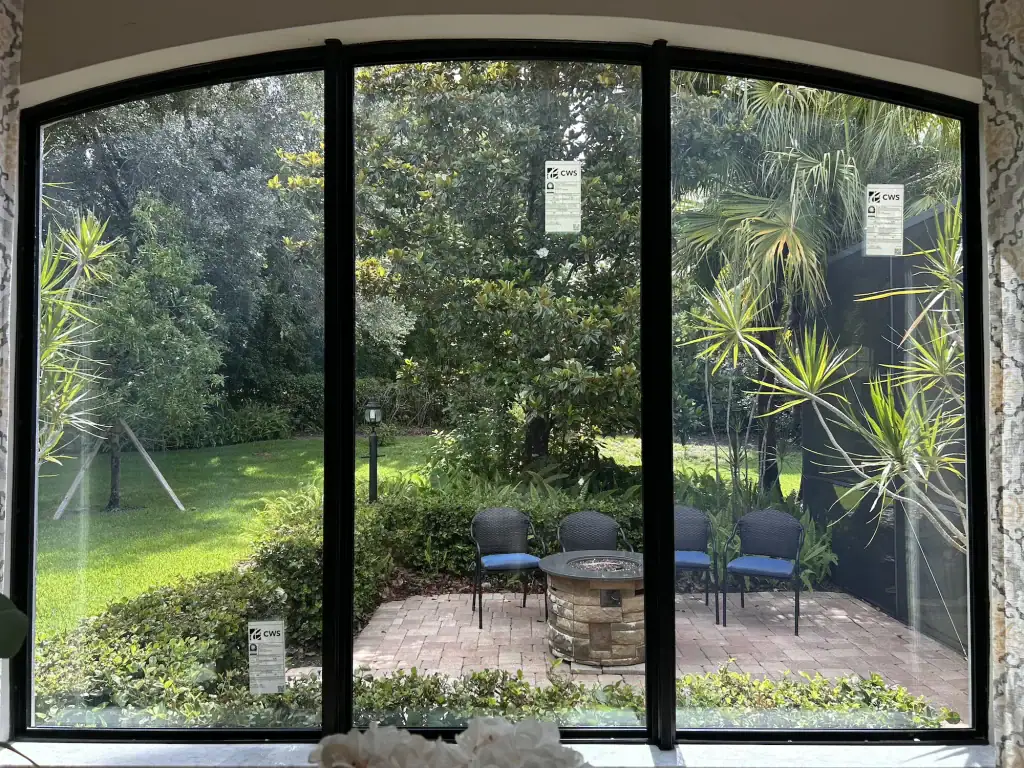 Sunlight shining through hurricane impact windows in a bright Florida living room