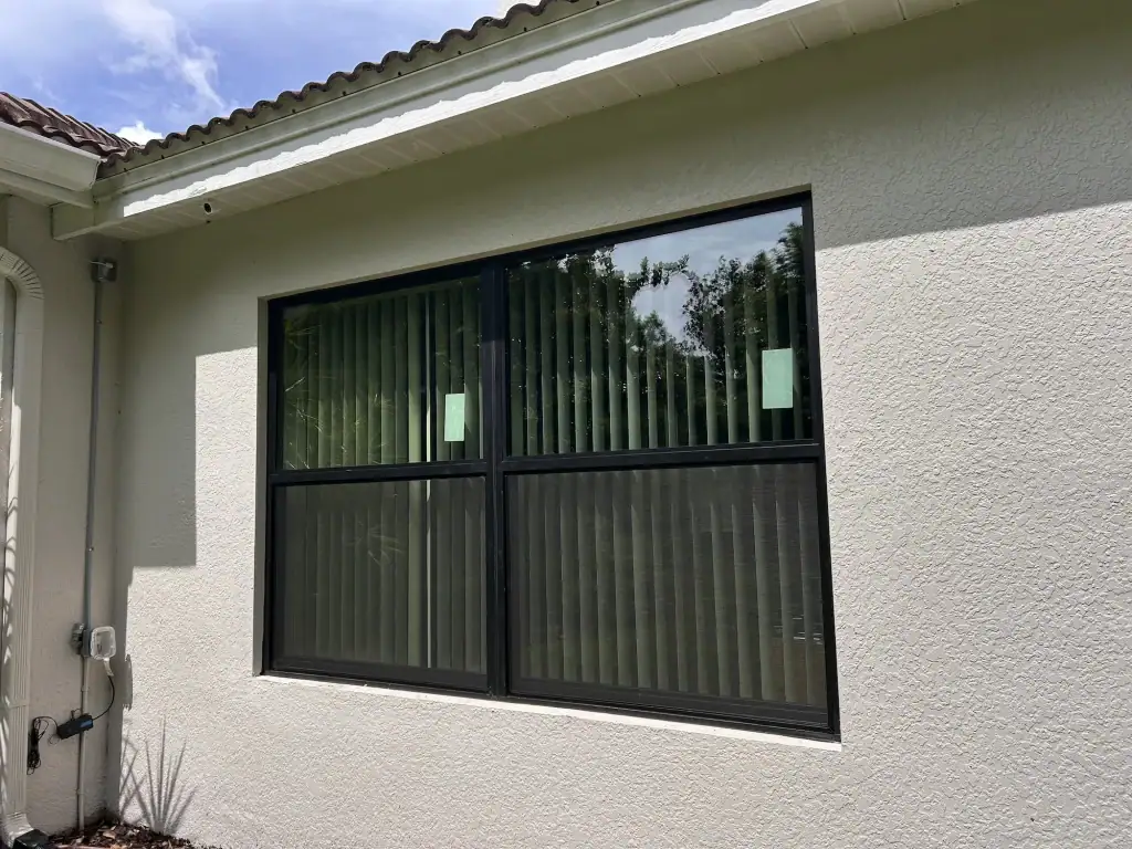 Hurricane impact window brands installed on a coastal home.