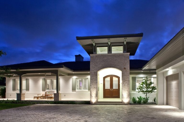 Florida home exterior with impact windows at dusk