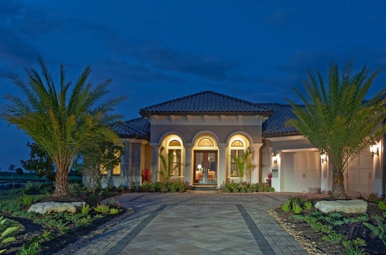 Florida home with PGT WinGuard impact windows at dusk