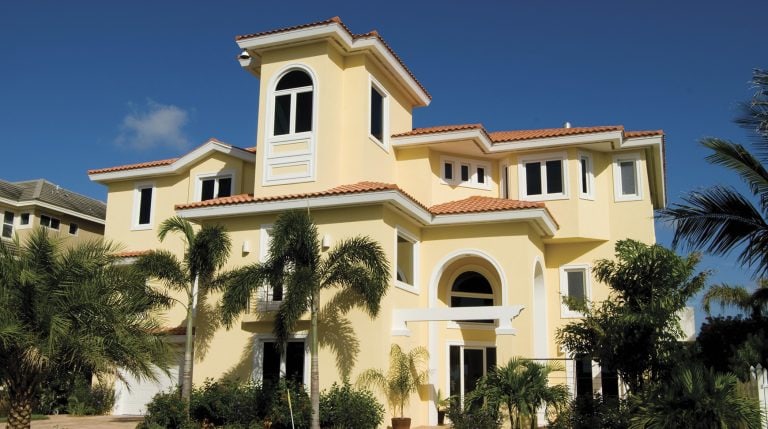 Multi-story coastal building with Simonton StormBreaker Plus impact windows