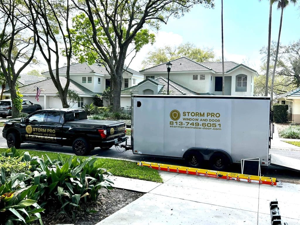 Storm Pro Window and Door truck and trailer at a Tampa Bay installation