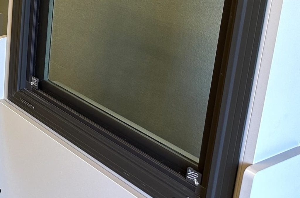 Impact window frame corner and hardware detail