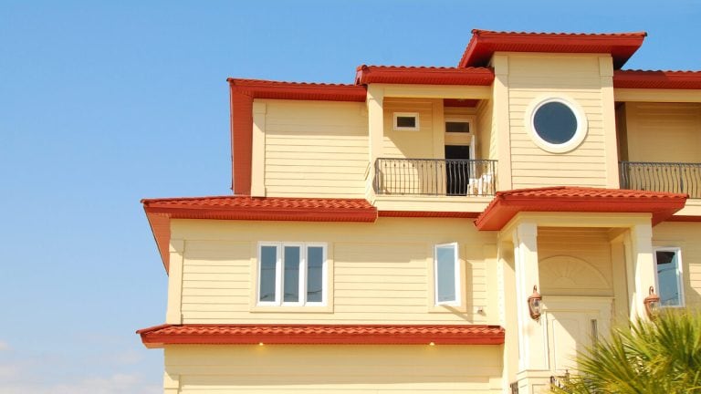 Florida home with round, rectangular and balcony window shapes