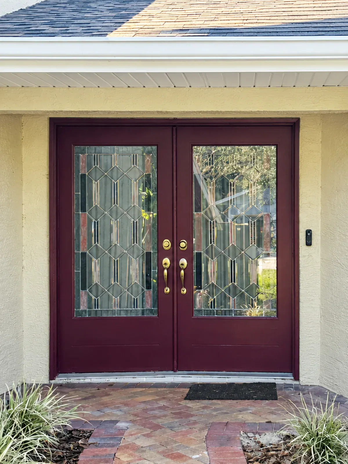 Double entry door before Burgundy double entry doors with leaded glass before replacement