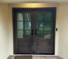 Dark impact double entry doors with divided glass installed by Storm Pro