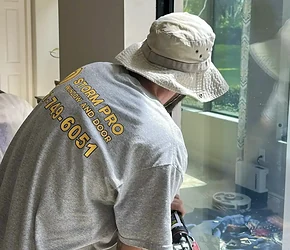 Storm Pro installer sealing a new impact window during installation